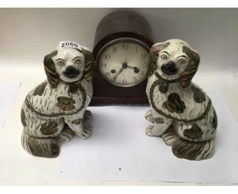 A pair of Staffordshire lustre dogs and a 1930s mantle clock