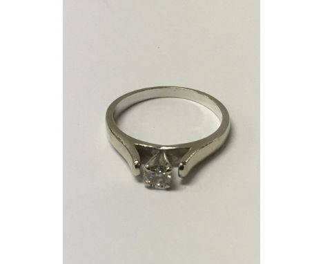 A 14ct white gold, diamond solitaire ring, square cut ring, stone approx .25ct. Size 0, 3.5 g