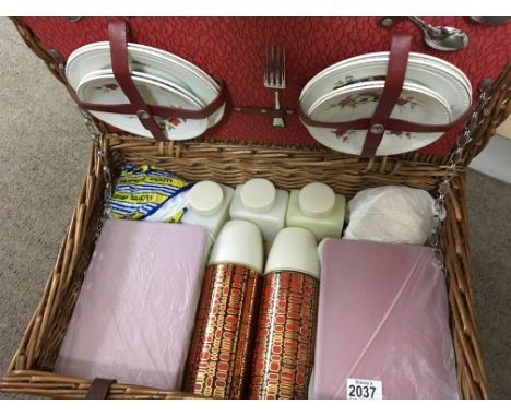 A vintage brextion picnic basket and contents