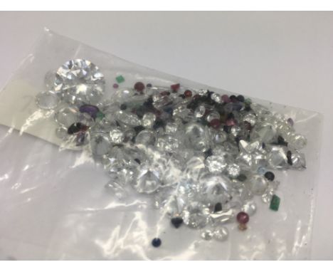 A bag of loose mixed stones including cubic zirconia, ruby, sapphire, amethyst and emerald. 91.43ct