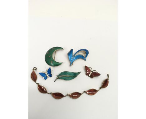 A similar lot of vintage, Norwegian silver and coloured enamel jewellery comprising brooches and a bracelet