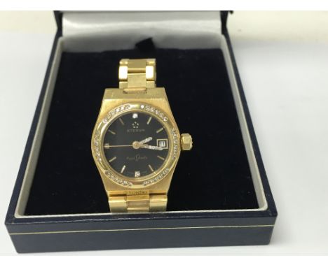 A Eterna 18 ct gold lady’s wristwatch the black dial with  quartz movement date aperture surrounded by diamonds,Engraved numb