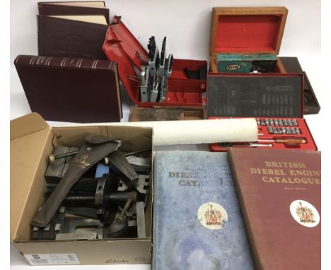 A collection of engineering tools including a micrometer and a Vernier