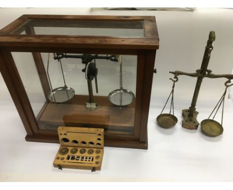 A set of beam balance scales in a fitted case plus a brass et of scales (2).
