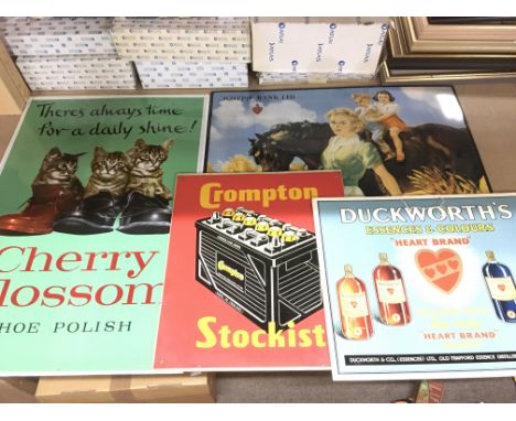 A collection of vintage style advertising signs.