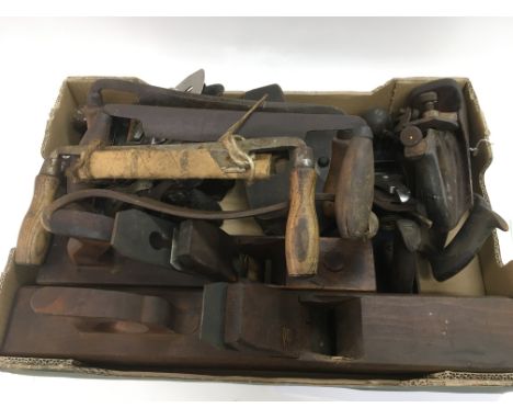 Two boxes of vintage woodworking tools including planes and chisels.