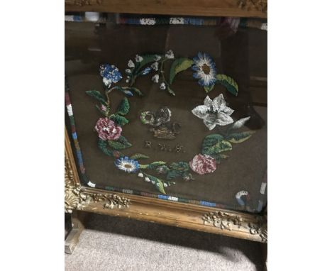 A Victorian fire screen inset with a bead work panel and one other tapestry fire screen.