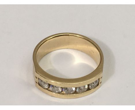A gent's 14k gold ring set with a band of six brilliant cut diamonds, approx 0.9ct.Size R, 7.9g