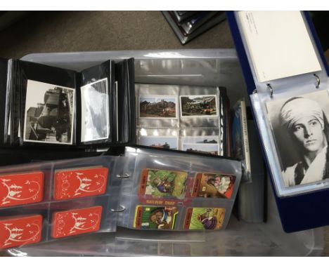 A box of postcards, playing cards, photographs of trains, books etc.