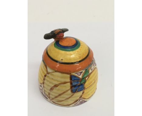 A Clarice Cliff 'Fantasque, Melon' pattern honey pot of ribbed shape.Approx 8cm, possible matched, overpainted lid.