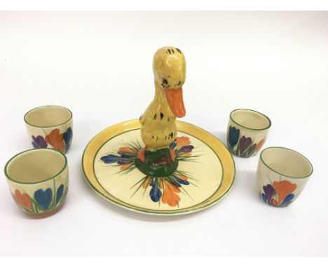 A rare  Clarice Cliff 'Duck' stand with four 'Crocus' pattern eggcups. Approx 15cm, some overpainting to stand
