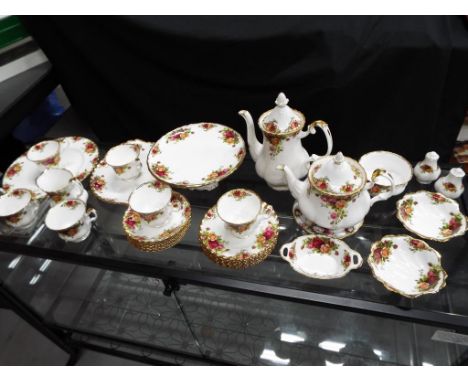 Royal Albert - thirty four pieces of Royal Albert Old Country Roses comprising tea pot, coffee pot, cake stand, cups, saucers