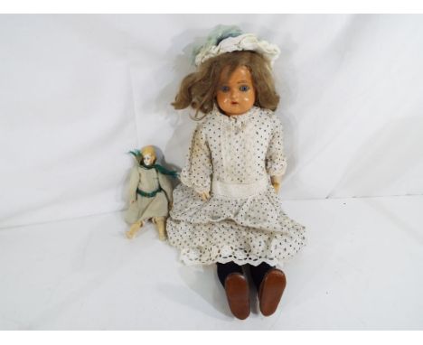Kammer &amp; Reinhardt - a Kammer &amp; Reinhardt dressed doll with celluloid head, jointed body, blue sleeping glass eyes, o