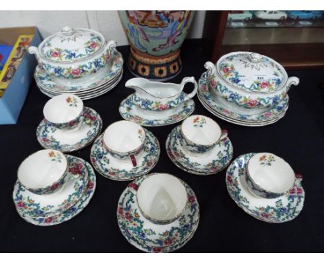 A quantity of ceramic tableware by Booths decorated in the Floradora pattern to include two lidded tureens, a gravy boat and 