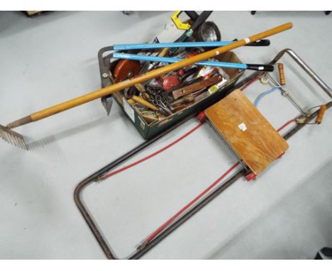 A good mixed lot of hand tools also included in the lot is a vintage mechanics creeper trolley