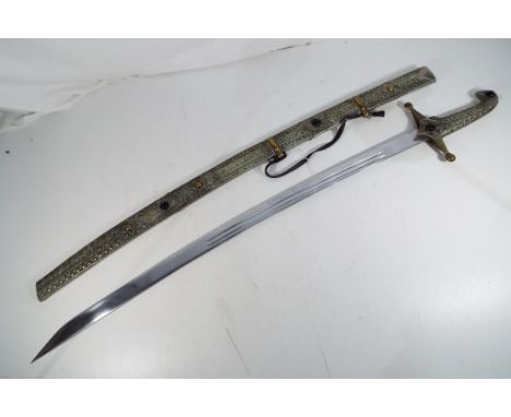 A Talwar style sword with intricately decorated matching scabbard approximately 92 cm total length. 