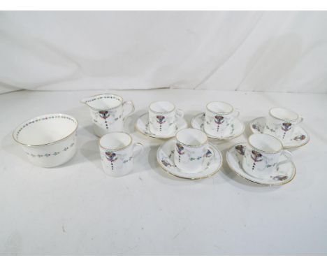 Shelley - a Shelley coffee set with floral decoration comprising five saucers, six coffee cans, sugar bowl and creamer Est £4