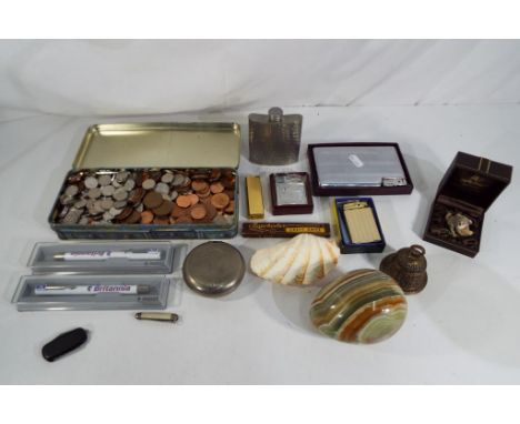 A lot to include a quantity of predominantly UK coins, cigarette lighters, hip flask, small brass bell, penknives and similar