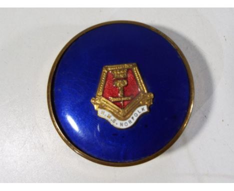A powder compact with blue enamel lid marked with crest for HMS Norfolk, verso marked metal, Made in England, complete with i