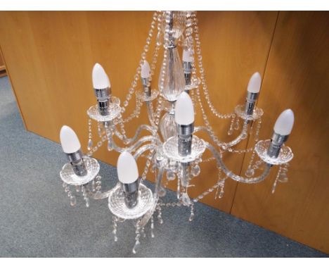 A large good quality glass nine armed chandelier with full glass droplet detailing Est £50 - £80