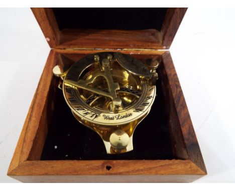 A Brass sundial / compass marked London, boxed Est £20 - £30