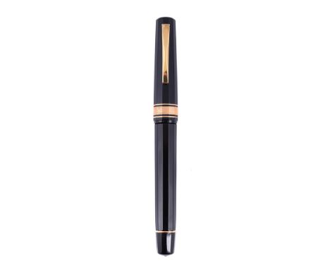 
	
		OMAS, EXTRA, A BLACK FOUNTAIN PEN
		Cap and Barrel: Black cap and barrel, the cap with gilt clip and cap band
		Nib and 