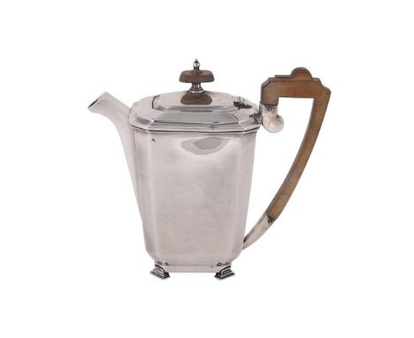 
	
		A SILVER OCTAGONAL HOT WATER POT
		WALKER &amp; HALL, SHEFFIELD 1939
		With a wooden octagonal finial and harp handle, o