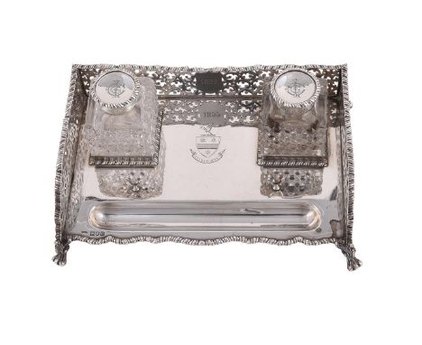 
	
		A VICTORIAN SILVER RECTANGULAR INKSTAND
		JOHN GRINSELL &amp; SONS, LONDON 1898
		With as gadrooned border, a pierced sc