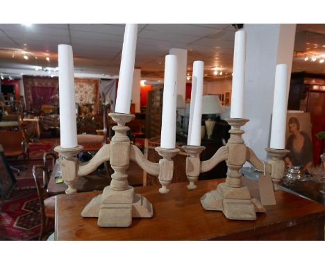 A pair of early 20th century pine three branch candelabra table lamps 