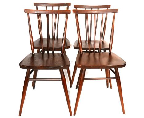 A set of four Ercol stick back dining chairs 