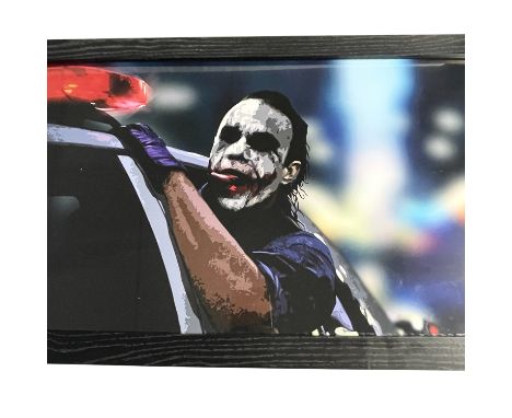 A large landscape framed and glazed art print off ‘The Joker’ from  Christopher Nolans “The Dark Knight ‘with Heath ledger as