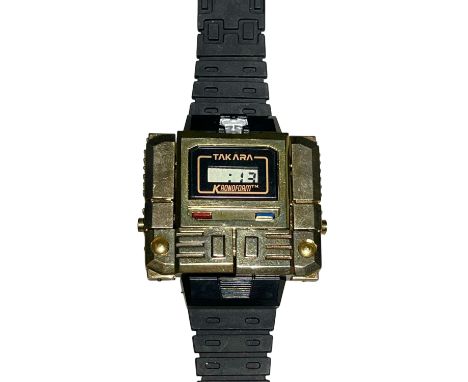 A fantastic, all original 1980s ‘Takara’Kronoform 'Microman' Robot Transformer Robot Watch’(!) in gold, on black strap, in fu