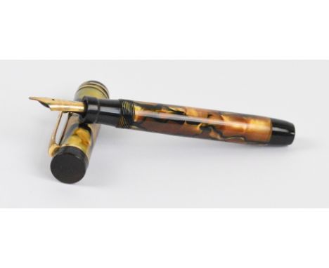 A Parker Duofold Junior fountain pen with pale green orange/brown pearl marbled body and 14ct yellow gold nib, length 11.6cm.