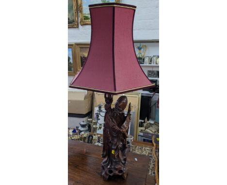 An early/mid 20th century Chinese figural carved table lamp, 92cm including shadeLocation: 