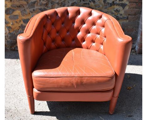 A mid century Italian leather tub chair by Minotti, designed by Rodolfo Dordoni, in red leather with button back on tapered l