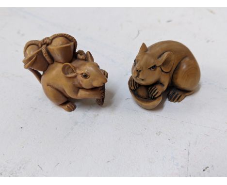Two Chinese carved wooden netsuke in the form of rats Location: 