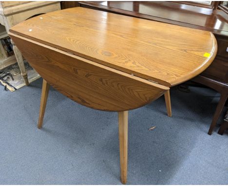 A mid 20th century Ercol light elm and beech gateleg table 71cm h x 113cm w Location: 