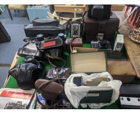 A selection of vintage film cameras to include a Zenith-E, Kodak Duaflex II, Kodak Retinette IB, Konica Autoreflex TC, Zenith