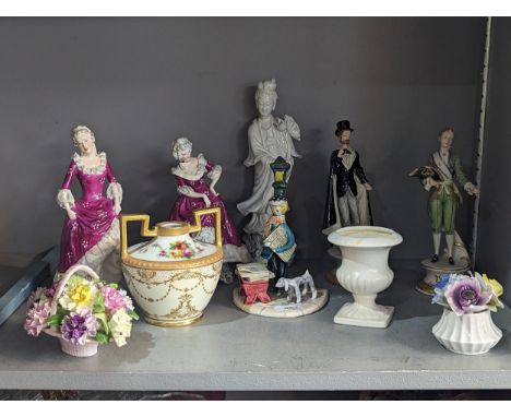 A group of ceramic figures to include Capodimonte 'Vienna 1850' and ' Madrid 1798' a pair of floral bone china figures of lad