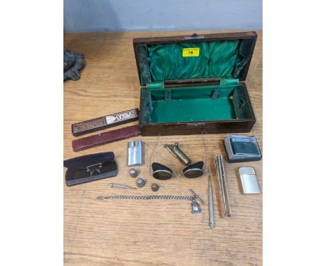A mixed lot to include propelling pencils, lighters to include a boxed silver match lighter, thimbles, a silver watch chain w