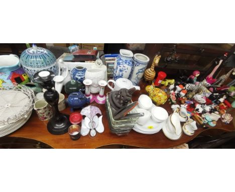 A Miscellaneous lot to include  Japanese kimono dolls, Russian nesting dolls, ceramic and wooden animal models, modern cerami