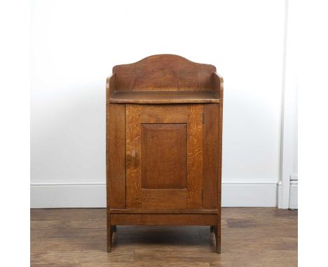 Cotswold School oak, side table or cupboard with galleried top, fielded panelled door and carved handle, unsigned, 55.5cm wid