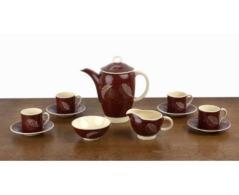 Susie Cooper (1902-1995) coffee set with leaf pattern on red ground, comprising of: coffee pot, four cups and matching saucer