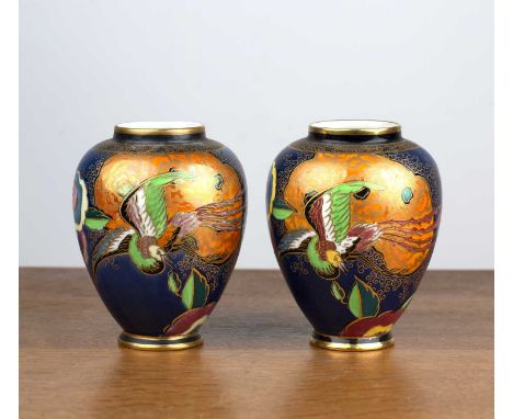 Pair of Carltonware vases with Art Deco bird decoration on blue ground, transfer marks to the base, 12.5cm high and one other