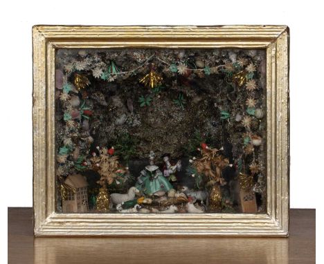 Folk Art diorama20th Century, a scene with animals looking in a mirror pond with straw work building decorated with shells an