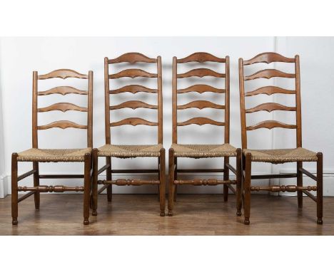 Gordon Russell (1892-1980) Four yew wood chairs with carved ladder and rush seats, two measures 112cm high, one measures 111c