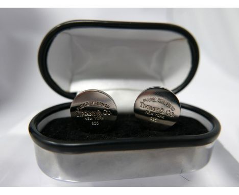 A pair of sterling silver, Tiffany &amp; Co cufflinks, each composed of a circular panel stamped 'please return to Tiffany &a