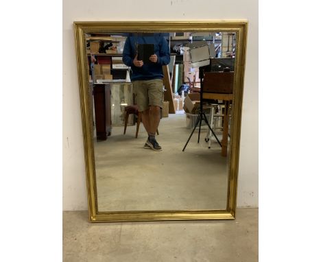 A large modern bevelled mirror in gilt frame.W:99cm x H:128cm