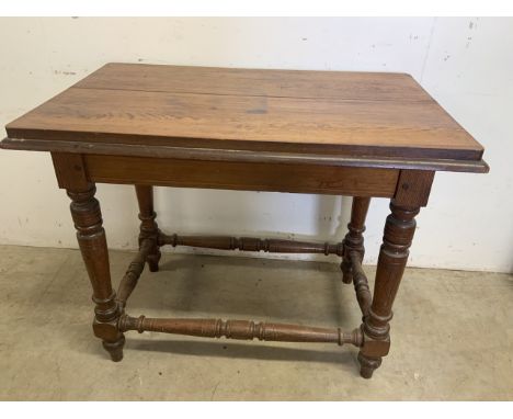 A small pitch pine console table with side stretchers. W:99cm x D:64cm x H:79cm
