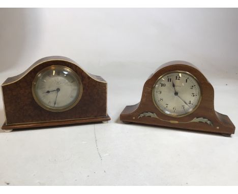A pair of Edwardian mantle clocks. An eight day clock with inlaid mother of pearl decoration, movement Swiss made and a walnu